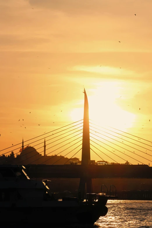 the sun is shining in a sunset over a boat