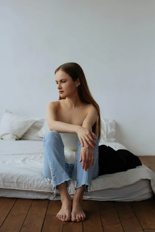 a  woman is sitting on top of a toilet