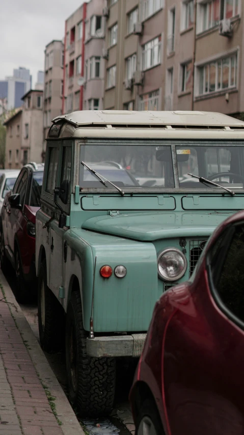 a jeep parked on the side of a city street