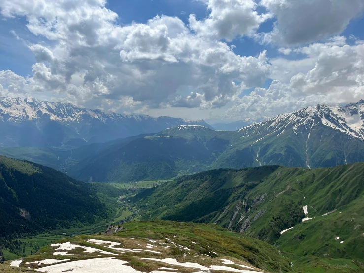 a view looking across the mountains at the clouds