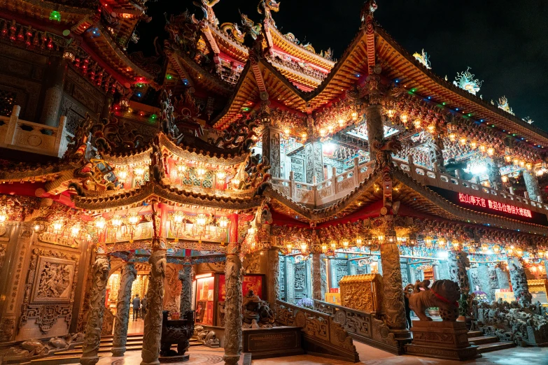 an ornate building with a bunch of lights lit up at night