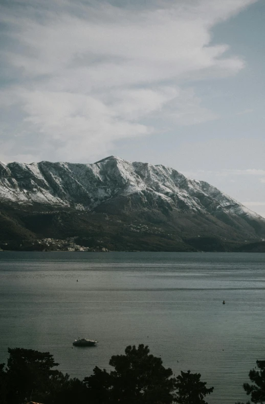 a boat sitting out on a large body of water