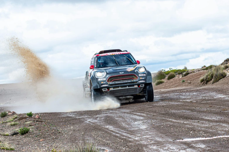 a mini pace pace car drives on a dirt road