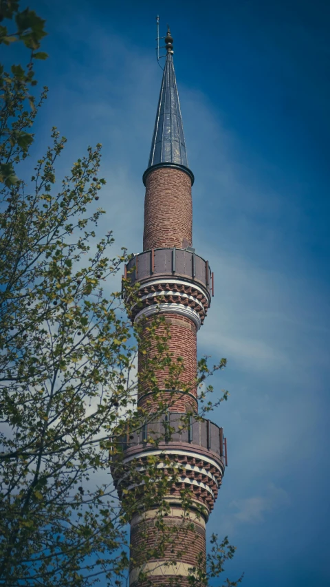 a very tall brick building with a tower