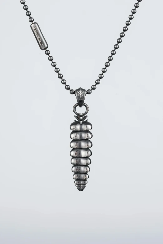 the necklace has a metal ball chain and a large silver bead pendant