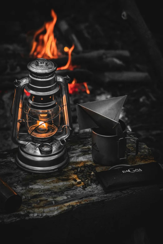 an old fashioned lamp sitting on top of a wooden table