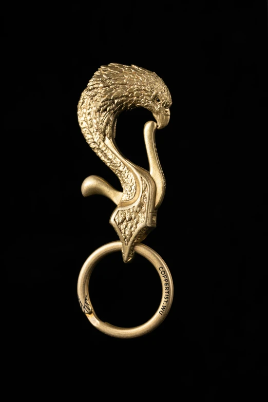 this gold snake has two rings on its neck