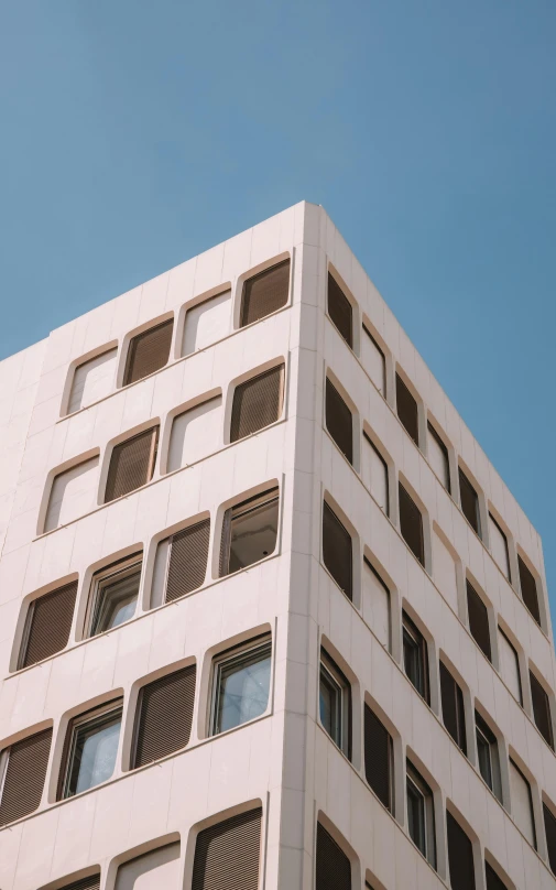 looking up at the corner of an unfinished building