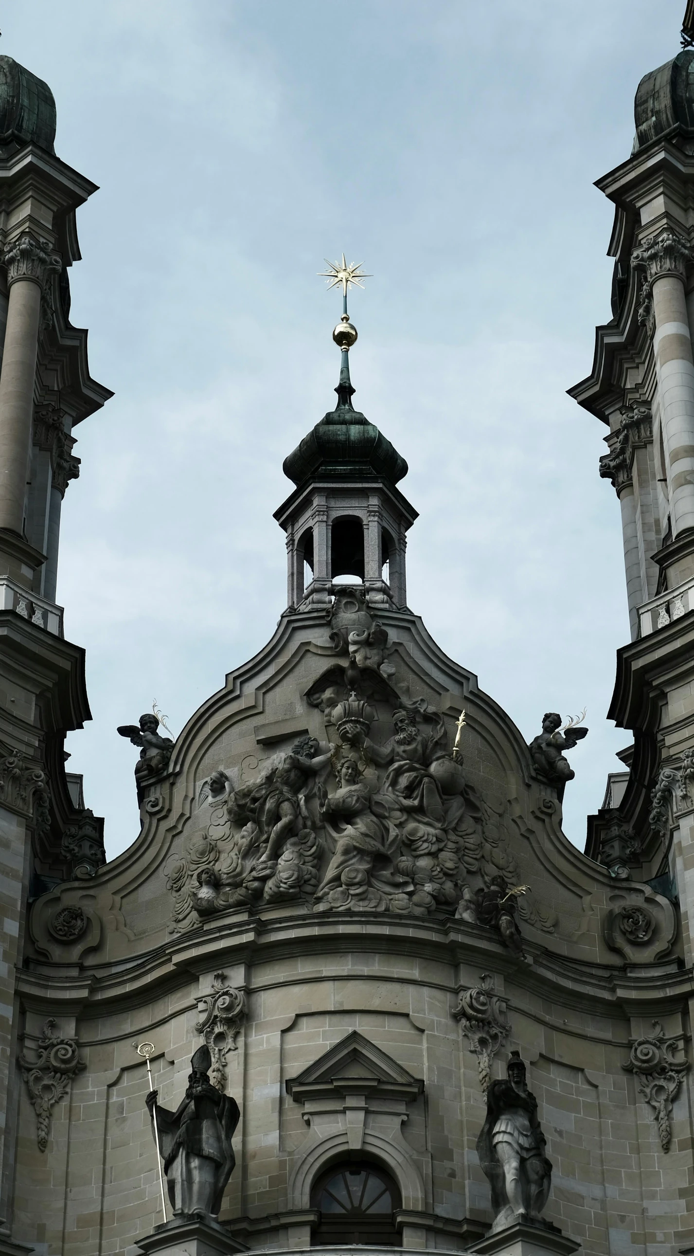 a church with some steeples and crosses on top