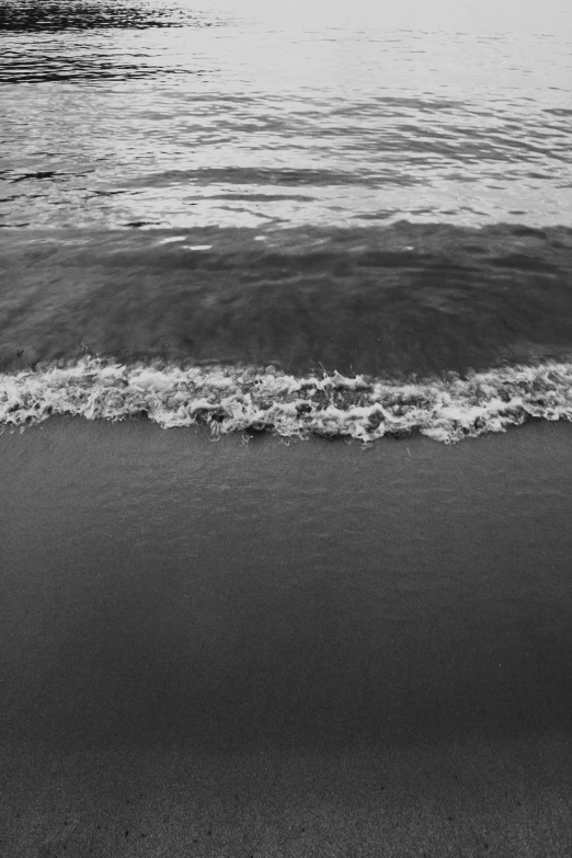 a couple of surfers are walking into the ocean