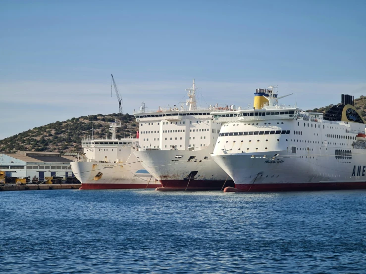 several large ships in a body of water