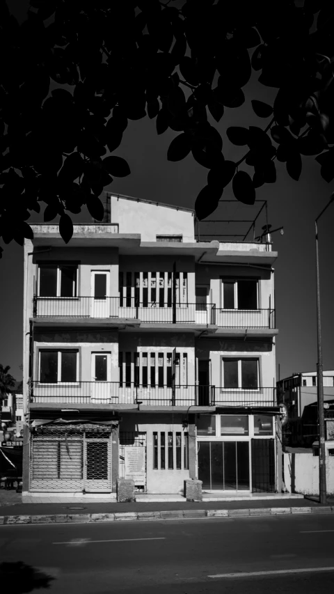 a building that is standing on a corner near the road