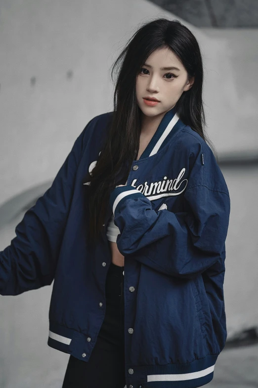 an asian woman is wearing a blue jacket