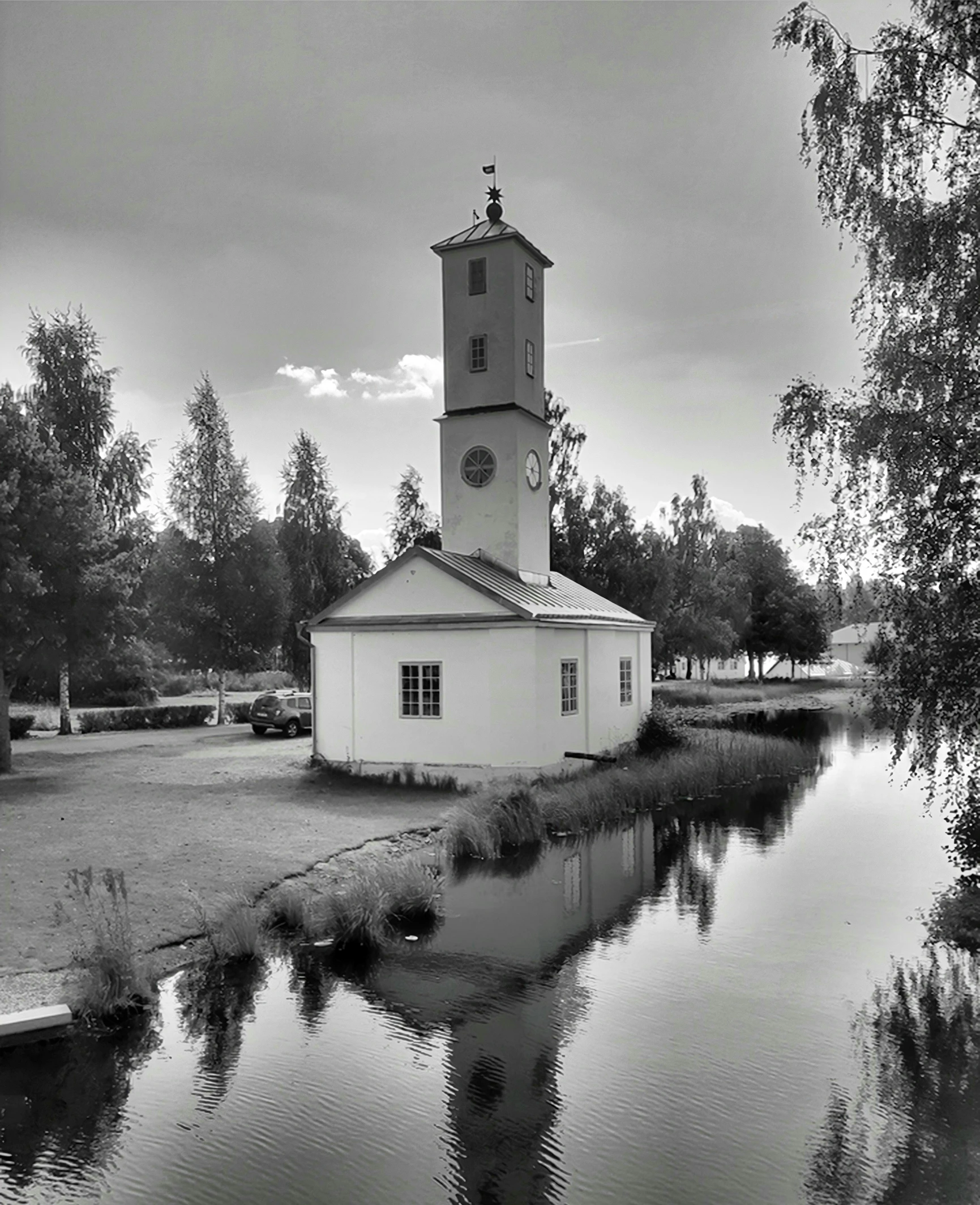 a church with a water way next to it