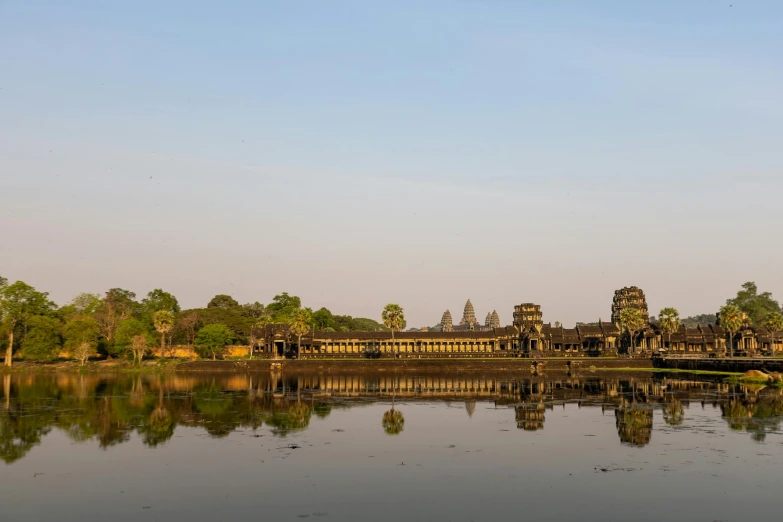 an old temple that has been built on the edge of a lake