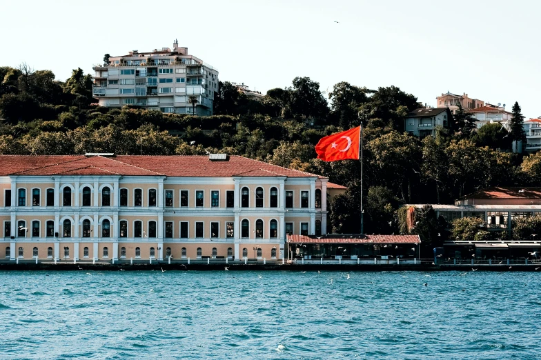 a large building with a flag on top of it