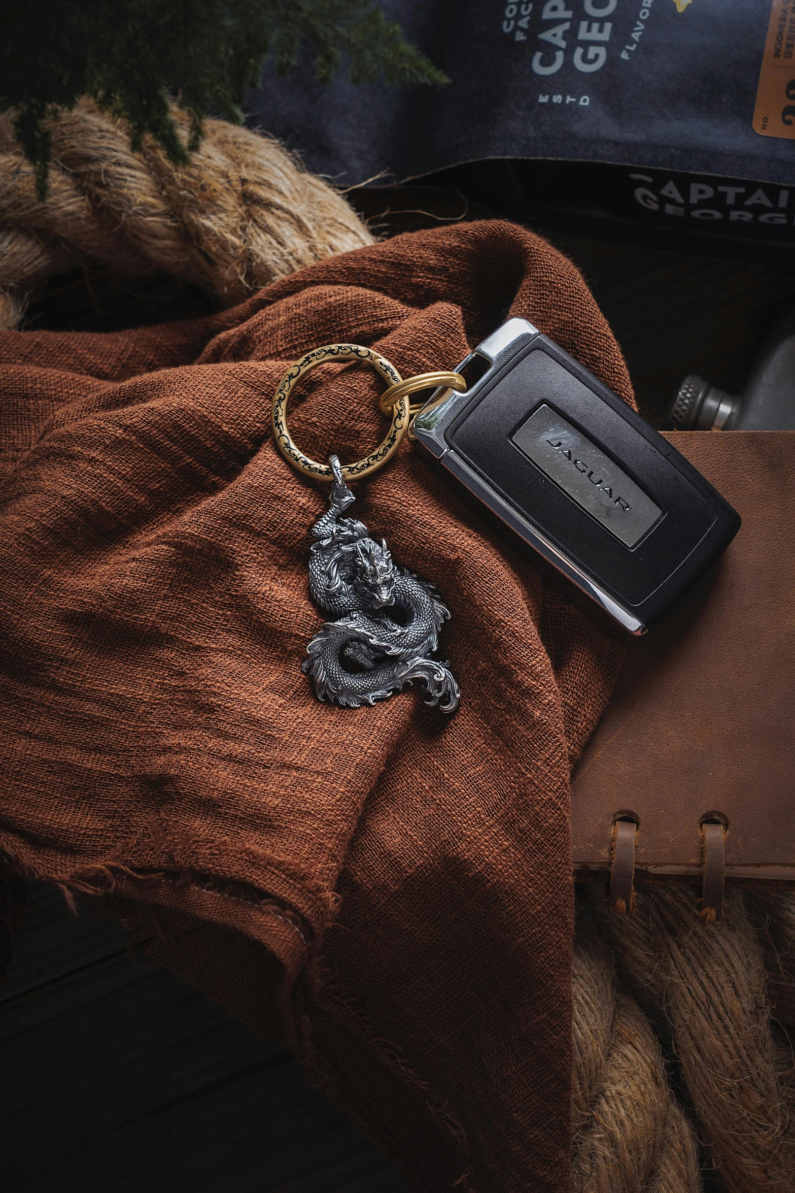 a pocket watch on a pile of brown fabric