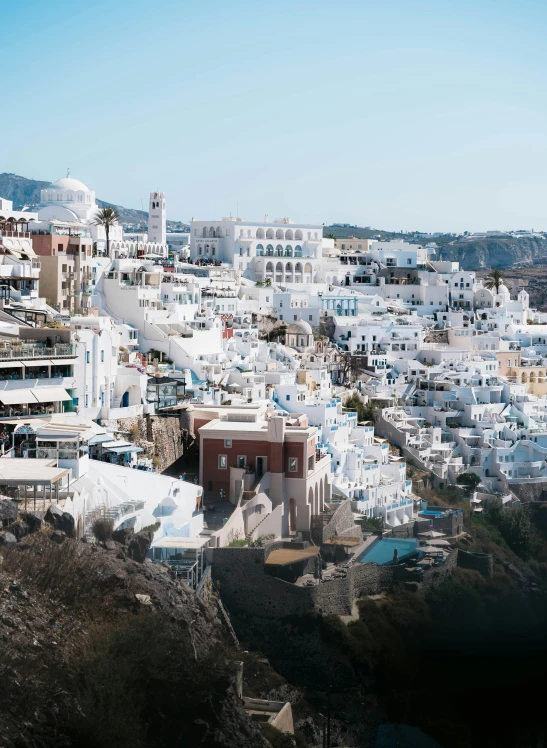 white buildings lining the hillside line of a town