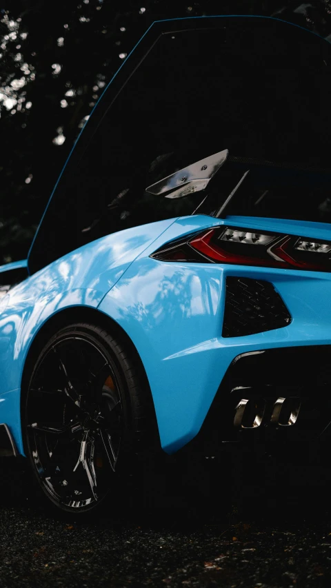 the rear of a blue sports car