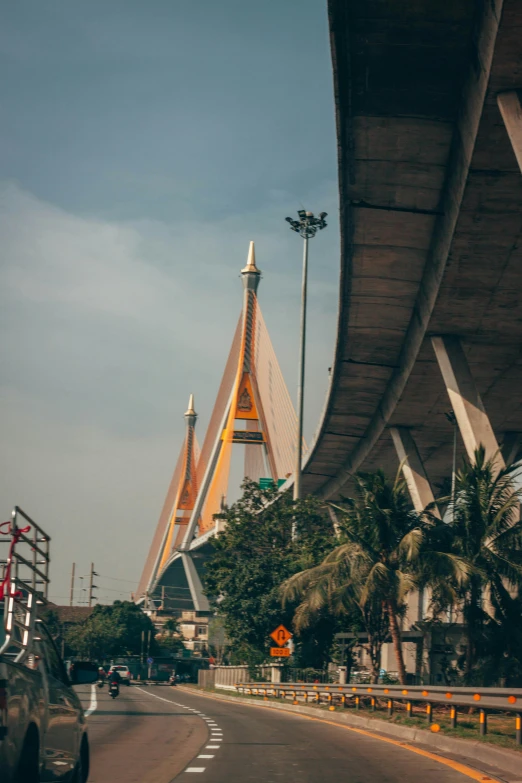 a large bridge next to a small building