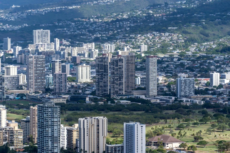 some very large buildings sitting in the middle of a lot