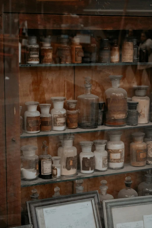 an old display case in a store displaying jars and knick knacks