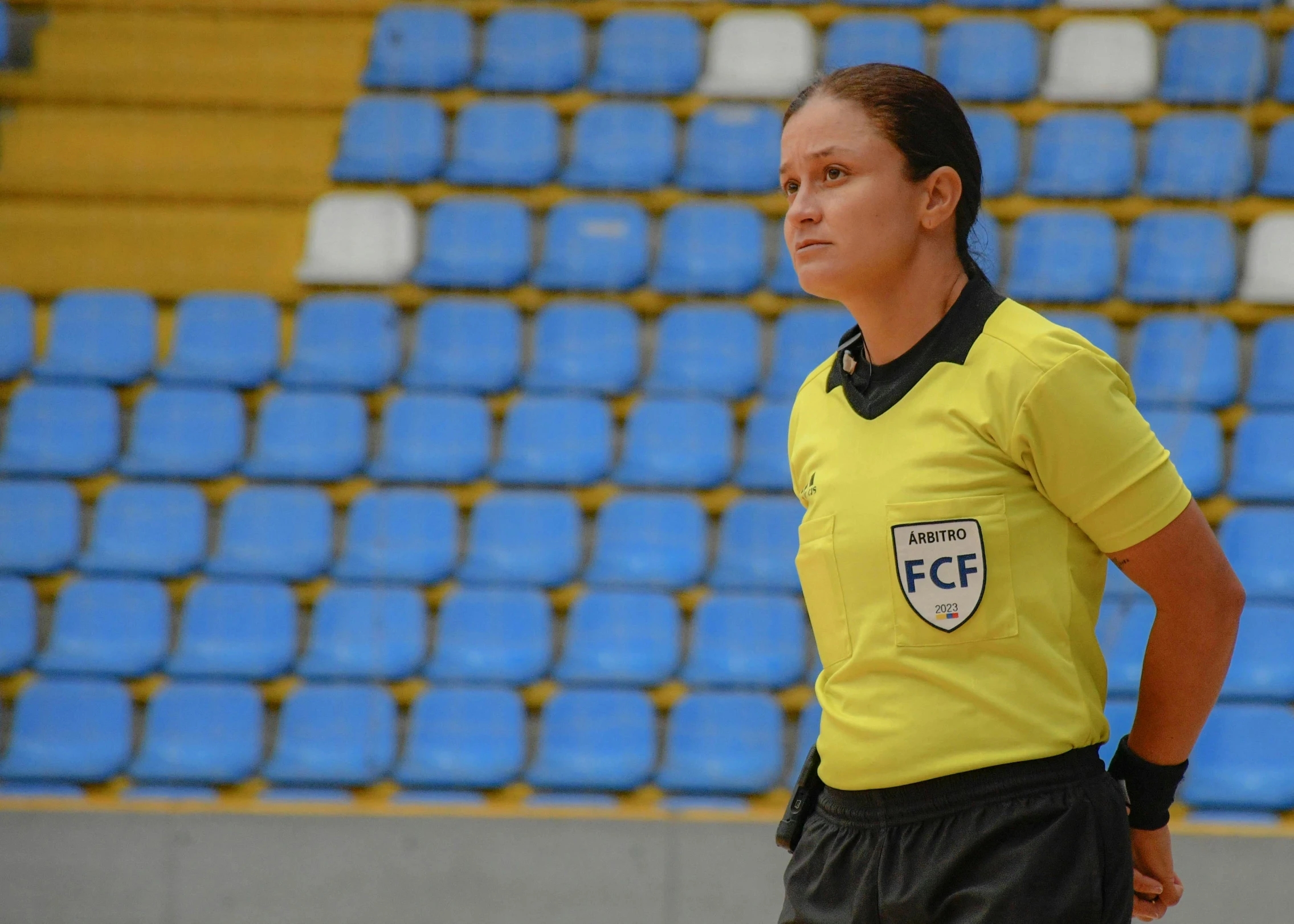 the woman is standing with her back turned to look like she's referee