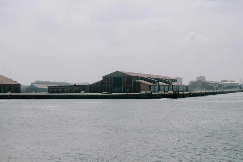 a big boat on a river by a building