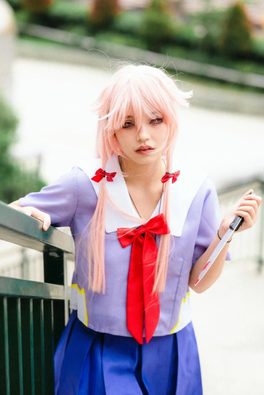 a girl in a dress and a red necktie