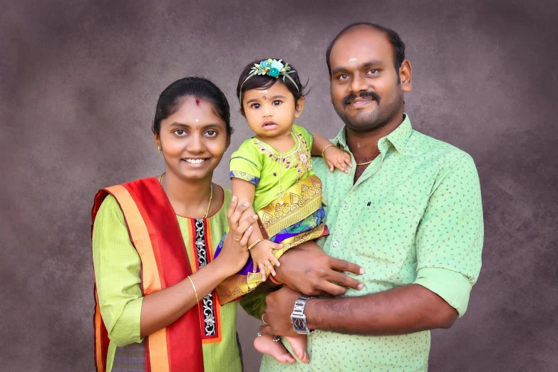 an indian family is posing for a po