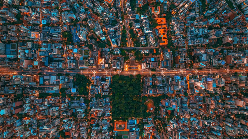 an aerial view of a city with a very bright street light