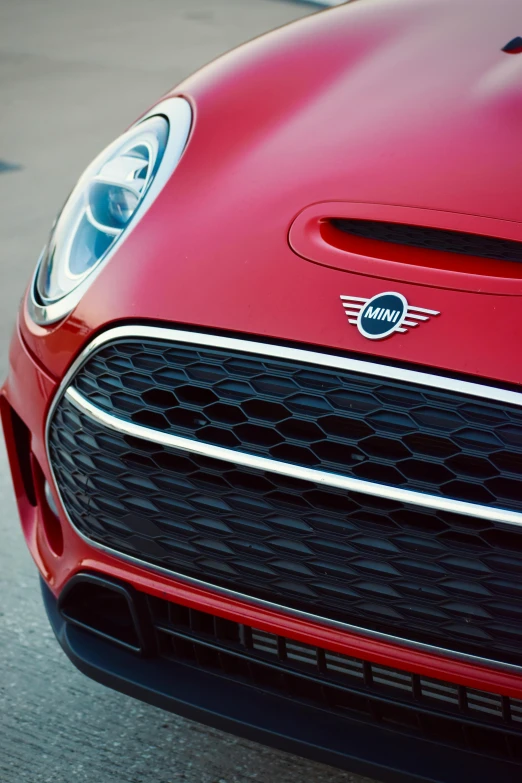 a close up of a car headlight on the street