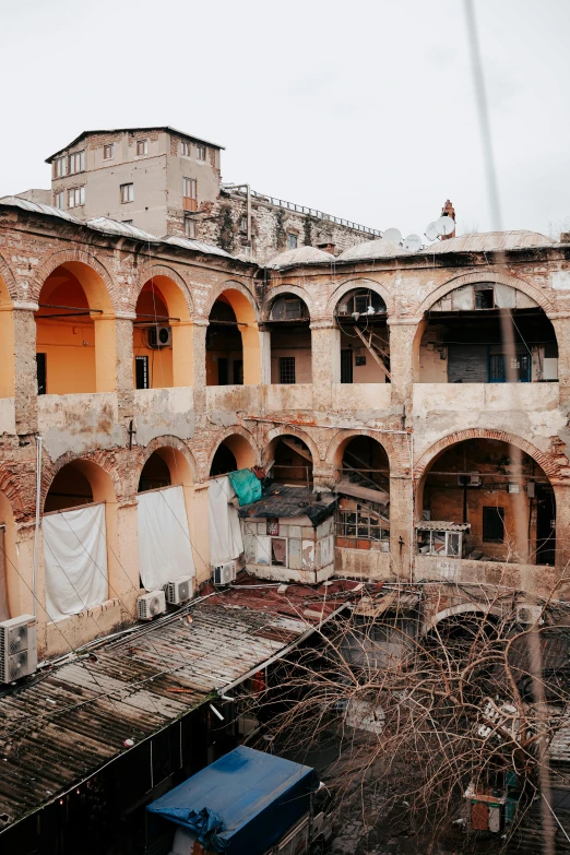 a building has been torn down with a tarp hanging from it