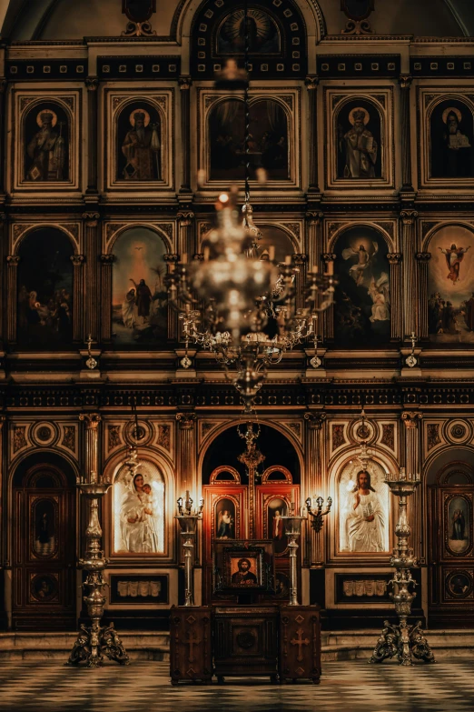 a church with a bunch of paintings on the wall