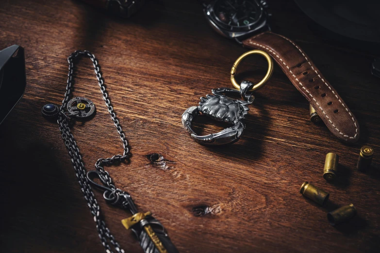 a pair of keys and other items on a wooden table