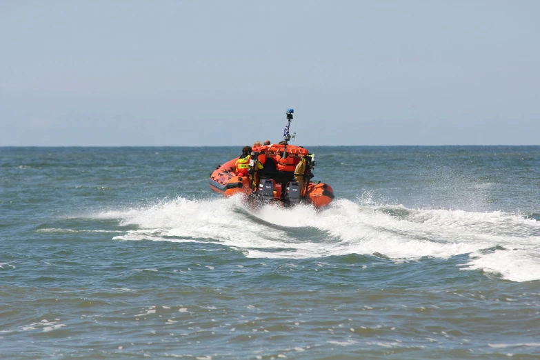 a raft filled with people is in the water