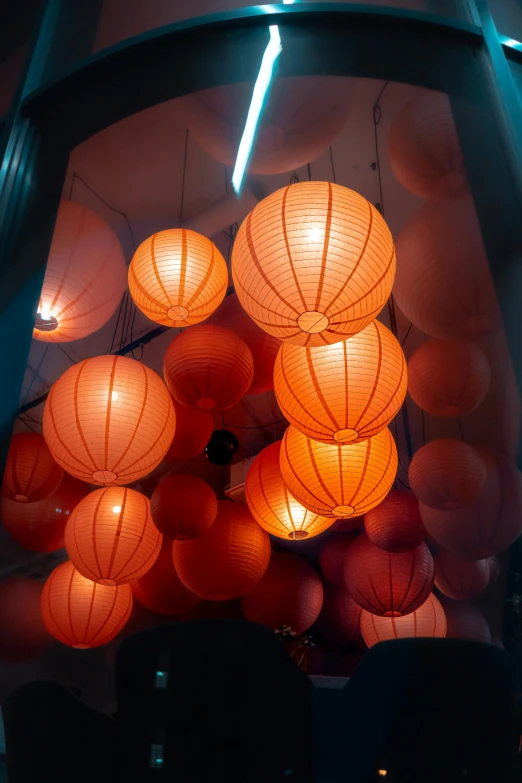 lighted chinese lanterns against a black background