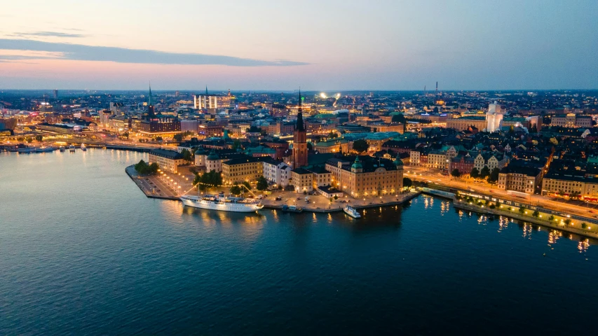 an aerial view of the city with many buildings at night