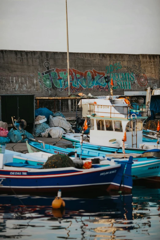 several boats are parked on the dock at the dock