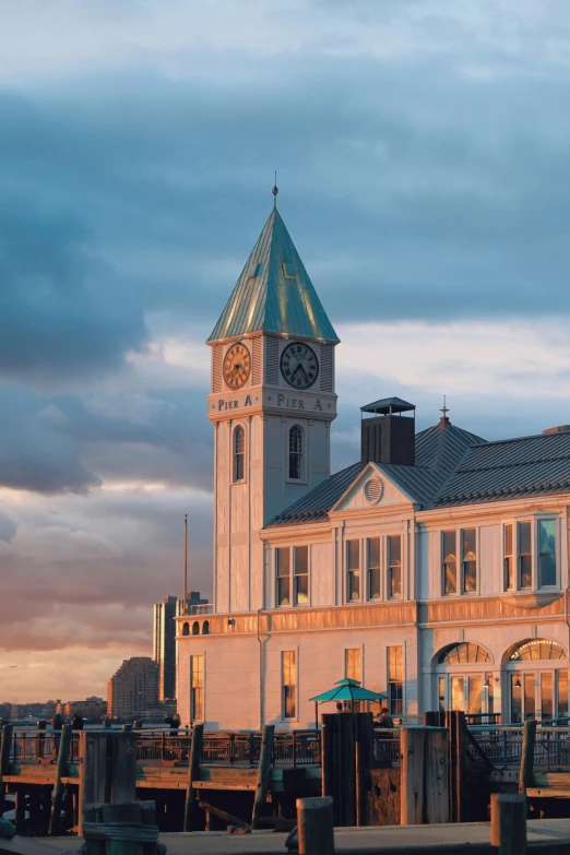 a large clock tower rises from a very tall building