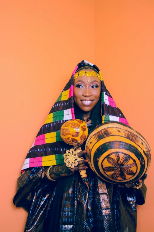 a woman holding two big round balls and some other items