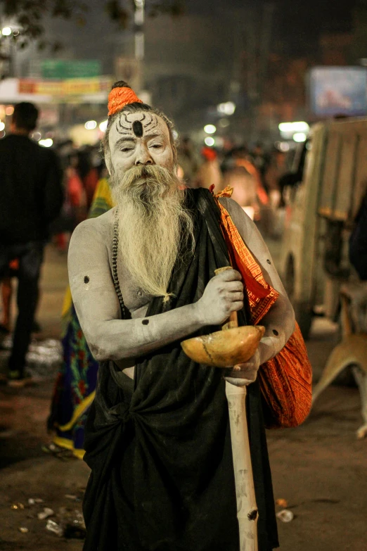 a man with a long beard and a white face