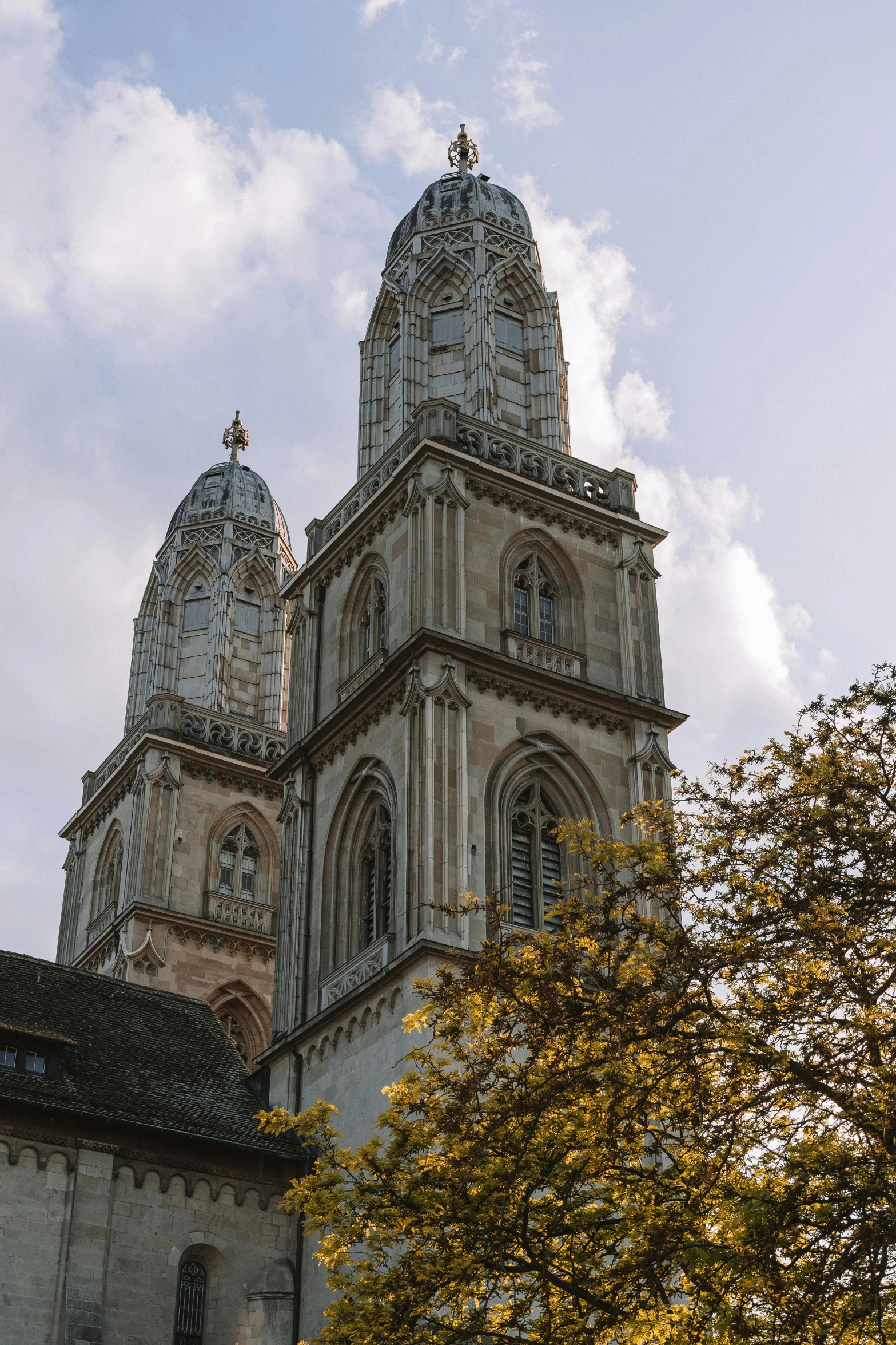 the tower of a building has several dome like structures