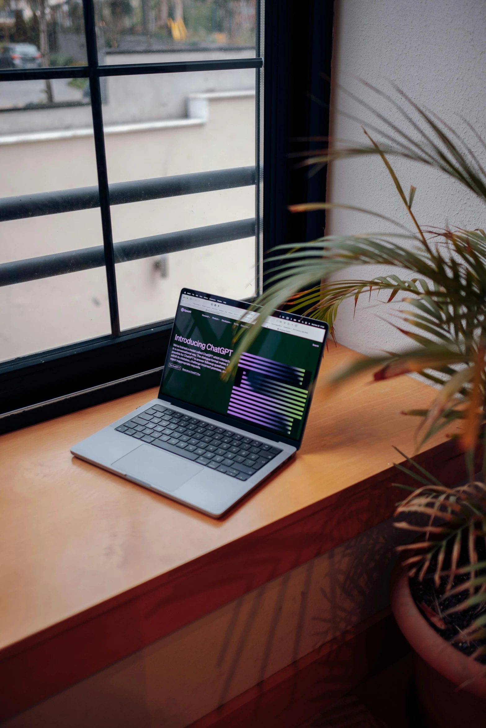 a desk with a laptop on top of it