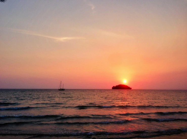 the setting sun as viewed from the beach