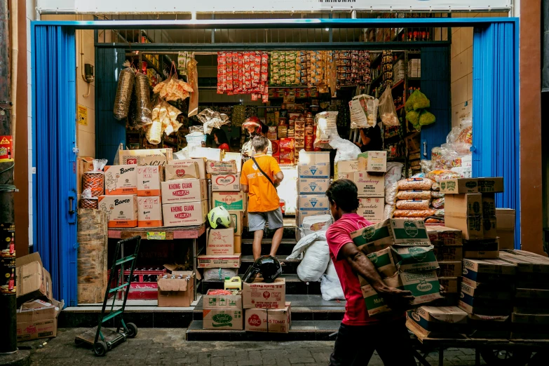 a man and child walking by a store window