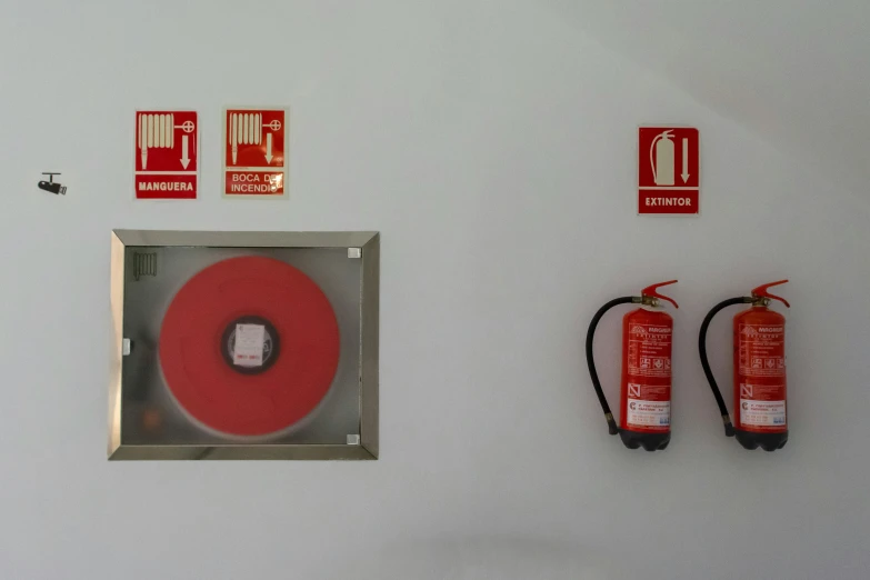 a room that has an electrical outlet and a fire extinguisher