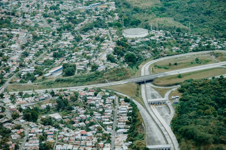 a city is next to a highway with a bridge