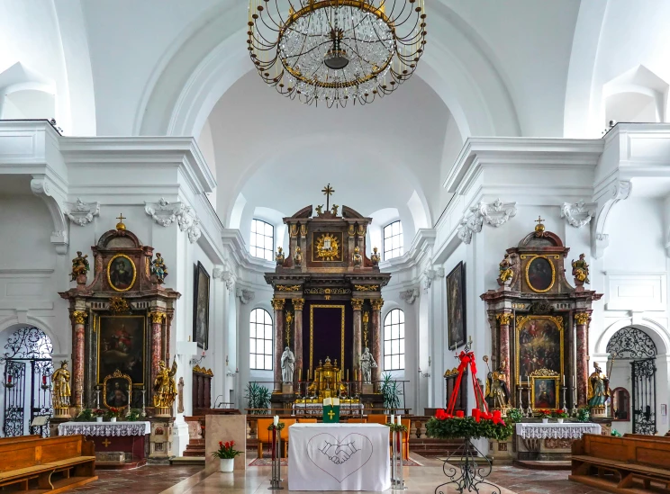 inside of a very large church with a clock in the center