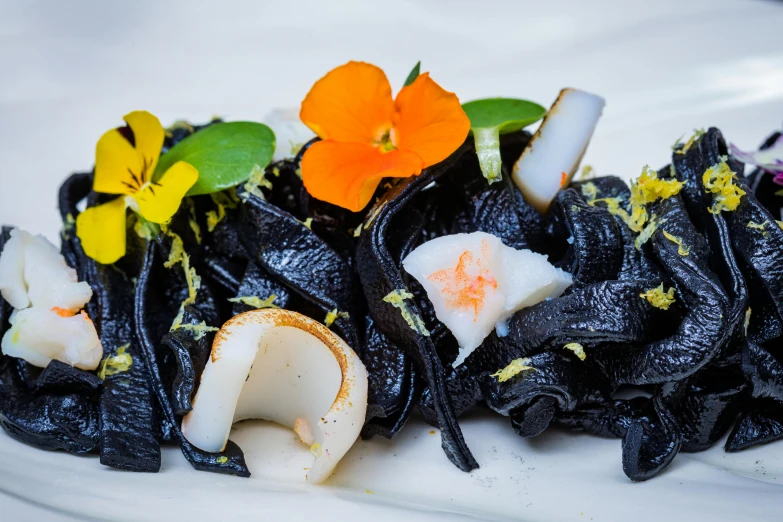 a white plate topped with a very colorful dish